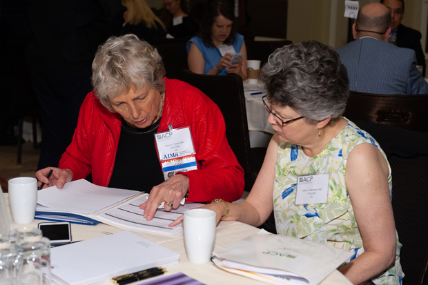 ACP Kansas Chapter members Donna E Sweet MD MACP left and Aileen C McCarthy MD FACP map out their plan before attending meetings on the Hill Photo by James Tkatch