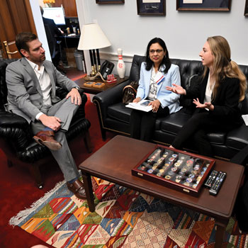 Elena Dennis ACP Medical Student Member center on couch talks to Rep Eric Swalwell D-CA while Shagun Bindlish MD FACP left and Leah Tudtud-Hans MD FACP not pictured look on Image by Greg Fiume